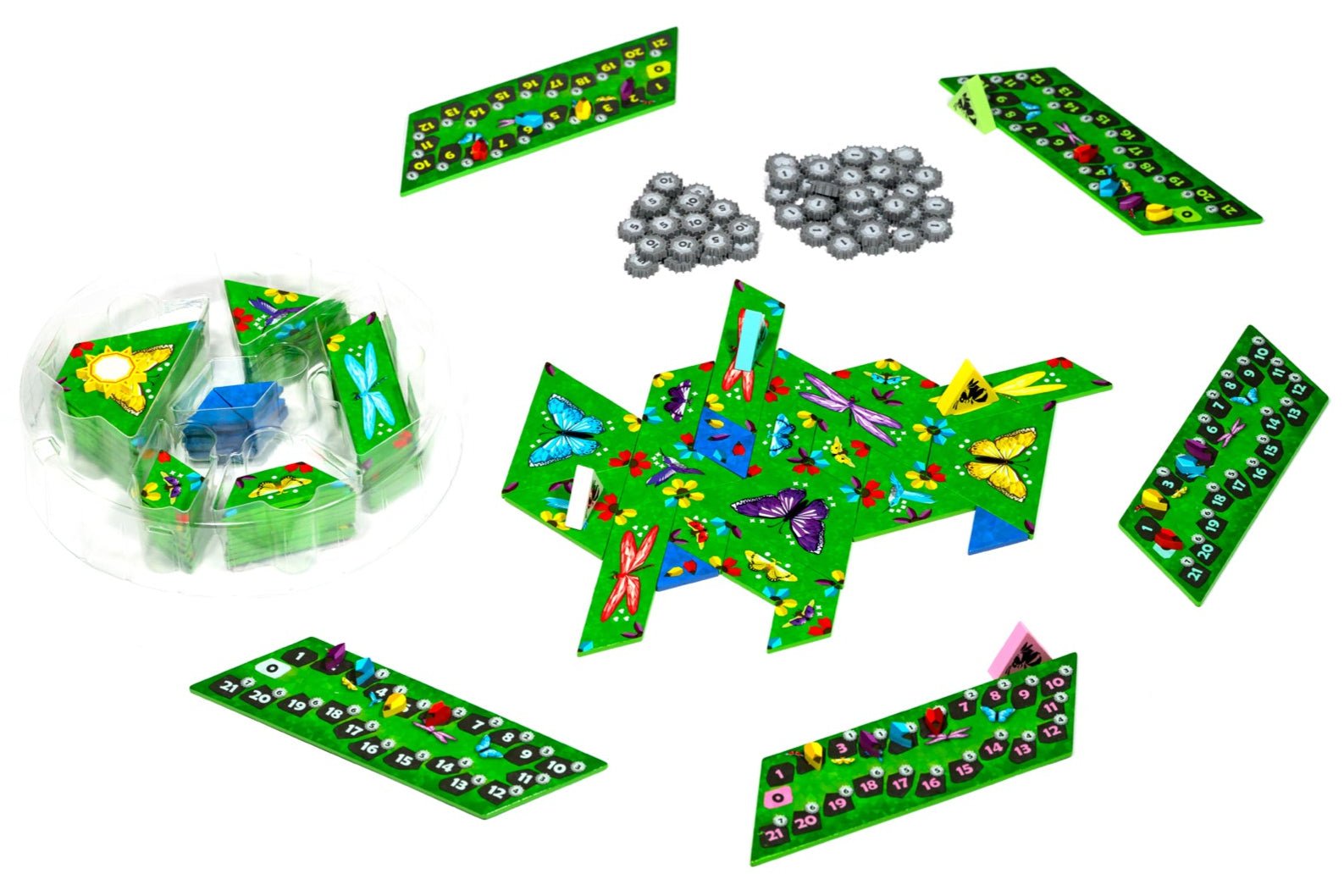 Board game components including green boards with colorful markers and silver pawns on a white background